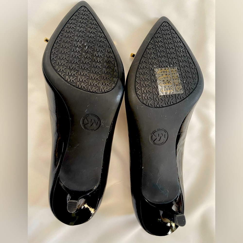 Brand new Michael Kors pattern leather heels.  size  8M. Never been worn